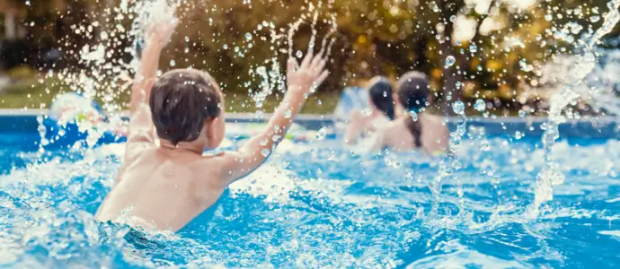 Children swimming in a personal pool.