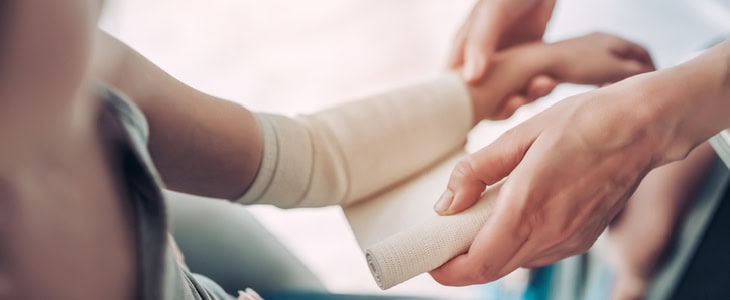 little girl getting bandages for her burn injury