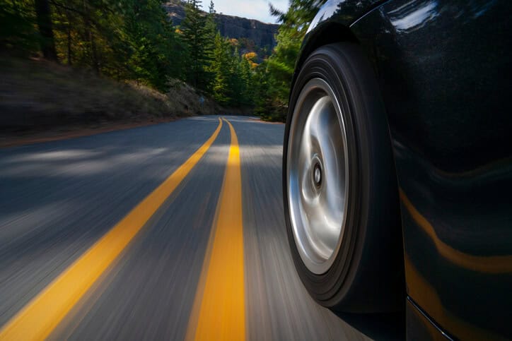 Car driving down road