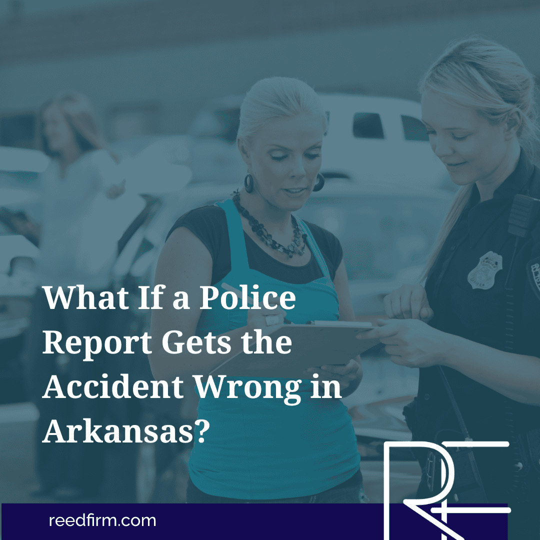 Driver reviewing accident details with a police officer, illustrating issues that can arise from an incorrect police report in Arkansas car accidents