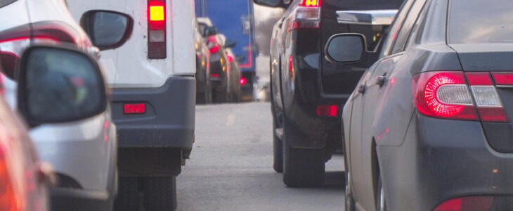 A line of cars stuck in traffic after a rear-end accident